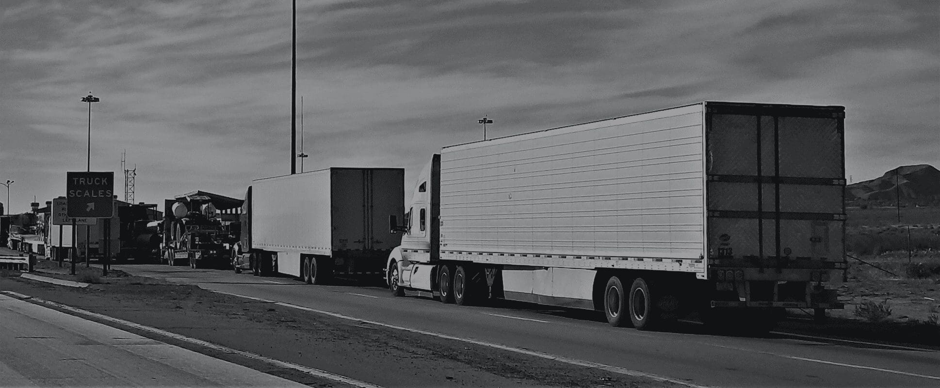 Articulated HGV parked outside an industrial warehouse