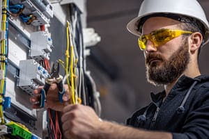 a male electrician works in a switchboard with an 2023 11 27 05 35 08 utc 1