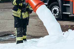 cropped shot of firefighter extinguishing fire wit 2023 11 27 05 05 42 utc 1